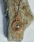 Mixed metal sunburst pendant