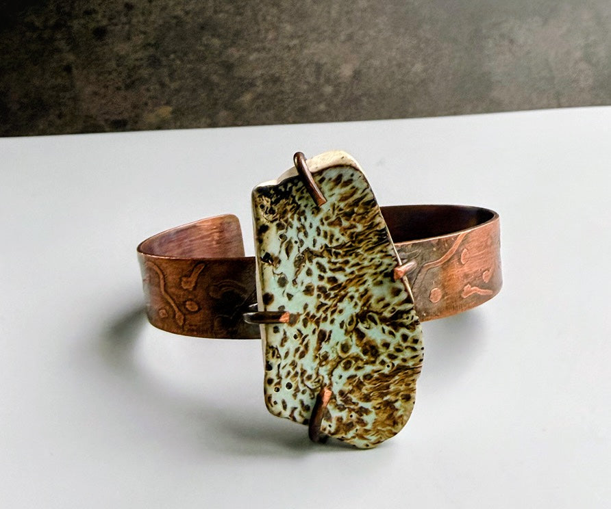 Etched copper cuff with green pottery shard