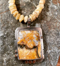 Granilloite and raw beryl with silver link chain. 26”
