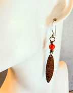 Long copper oval with spiral pattern