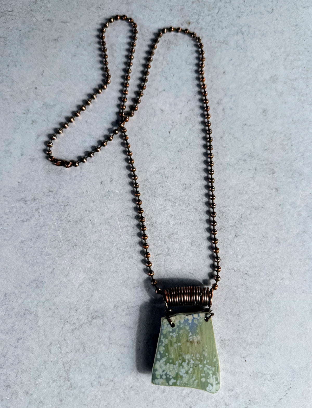 Earthy Transitions: Reversible Ceramic Shard Pendant
