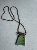 Earthy Transitions: Reversible Ceramic Shard Pendant