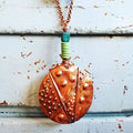 Foldformed Copper disk with chrysocolla and green African trade beads