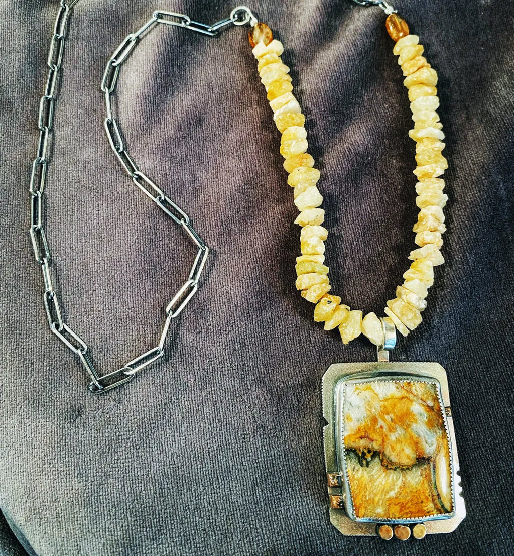 Granilloite and raw beryl with silver link chain. 26”