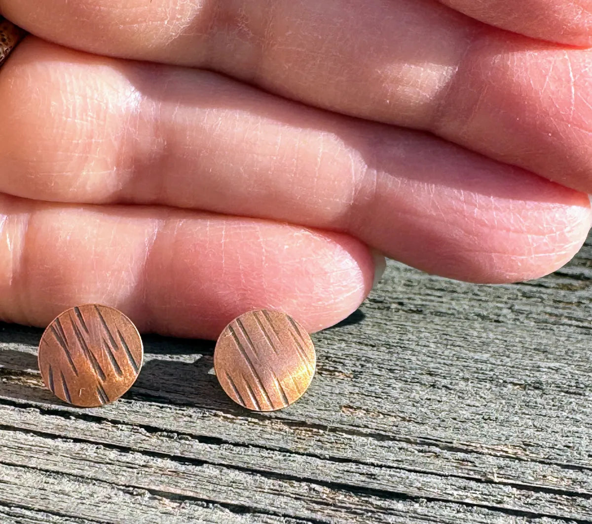 Tiny hammered copper studs with lines