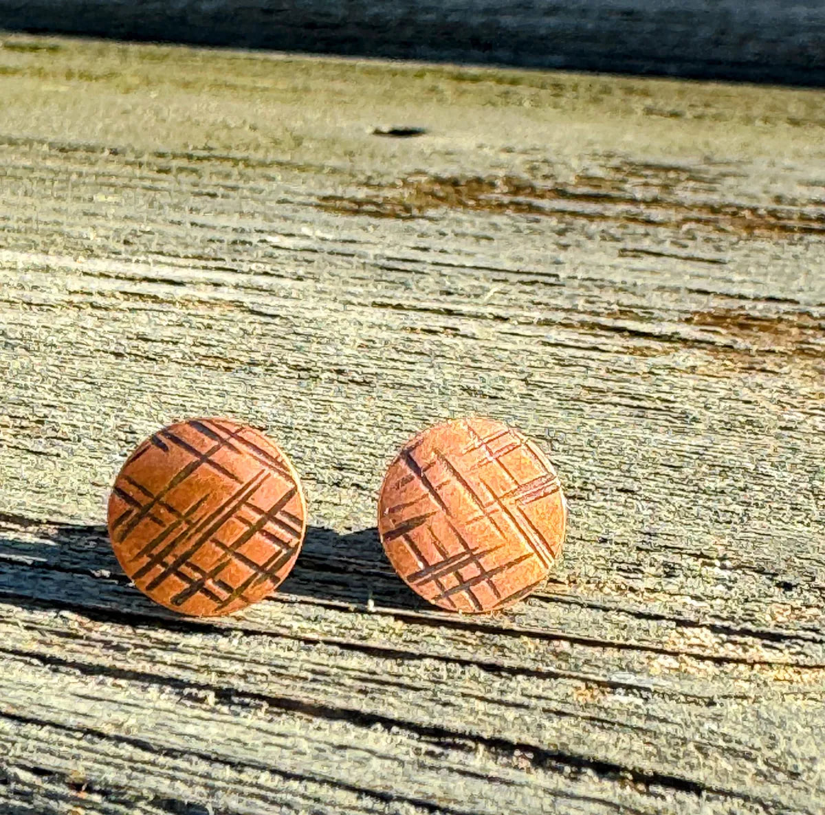 Tiny copper cross hatch studs
